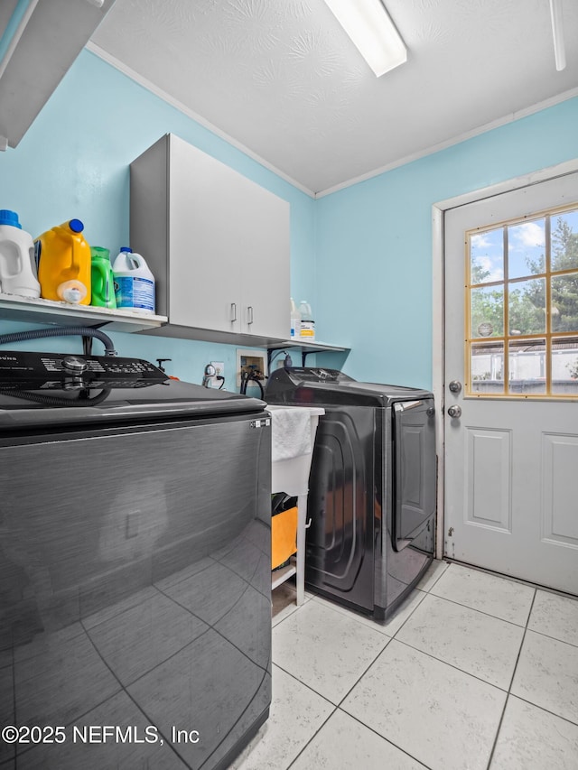 10811 High Ridge Rd, Jacksonville, FL 32225 - washroom with cabinet space, washing machine and dryer, light tile patterned flooring, and ornamental molding