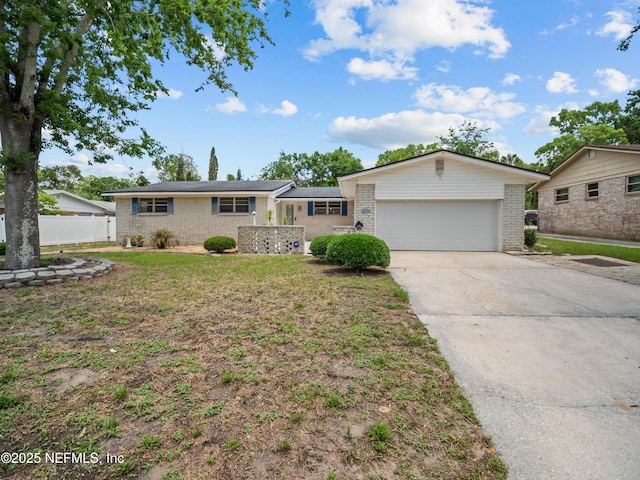 10811 High Ridge Rd, Jacksonville, FL 32225 - single story home featuring brick siding, concrete driveway, fence, and an attached garage