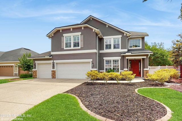 200 Huntston Way, Saint Johns, FL 32259 - view of front of home featuring stone siding, stucco siding, concrete driveway, and a garage