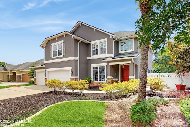 200 Huntston Way, Saint Johns, FL 32259 - traditional-style house featuring an attached garage, stone siding, driveway, and stucco siding