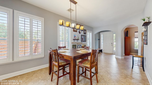 200 Huntston Way, Saint Johns, FL 32259 - dining area with arched walkways, baseboards, and light tile patterned floors