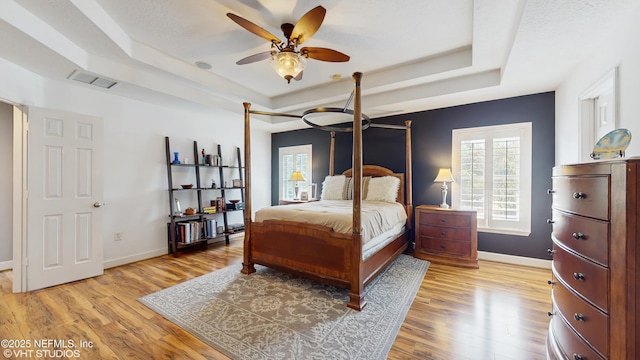 200 Huntston Way, Saint Johns, FL 32259 - bedroom featuring a raised ceiling, light wood finished floors, and baseboards