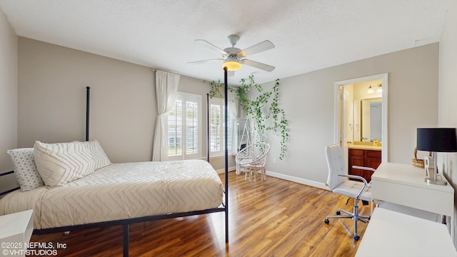 200 Huntston Way, Saint Johns, FL 32259 - bedroom with light wood-style floors, baseboards, a ceiling fan, connected bathroom, and a textured ceiling