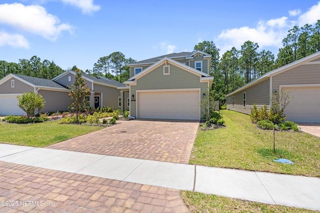 727 Lake Sinclair St, Saint Augustine, FL 32084 - view of front facade with a front lawn, decorative driveway, and an attached garage