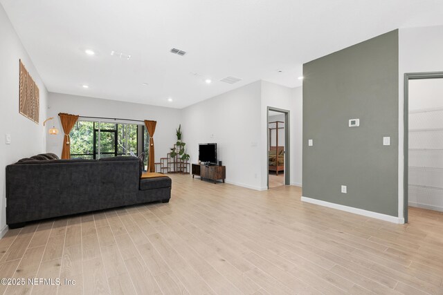 727 Lake Sinclair St, Saint Augustine, FL 32084 - living room with light wood-style floors, recessed lighting, and baseboards