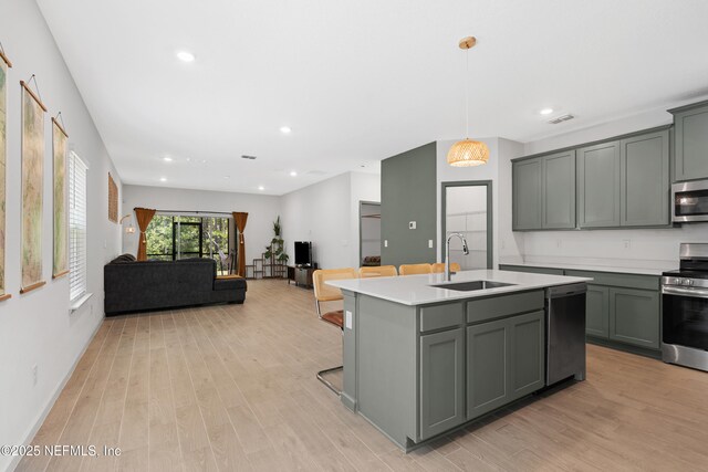 727 Lake Sinclair St, Saint Augustine, FL 32084 - kitchen featuring a sink, appliances with stainless steel finishes, gray cabinetry, light countertops, and recessed lighting