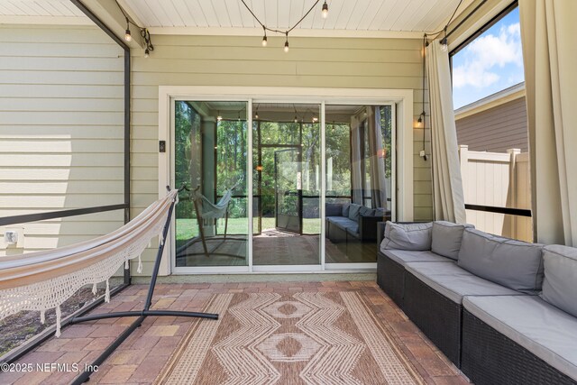 727 Lake Sinclair St, Saint Augustine, FL 32084 - sunroom featuring an outdoor hangout area