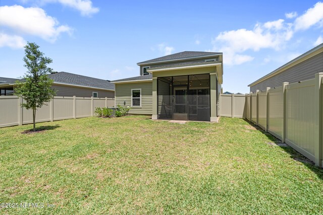 727 Lake Sinclair St, Saint Augustine, FL 32084 - rear view of house featuring a sunroom and roof with shingles