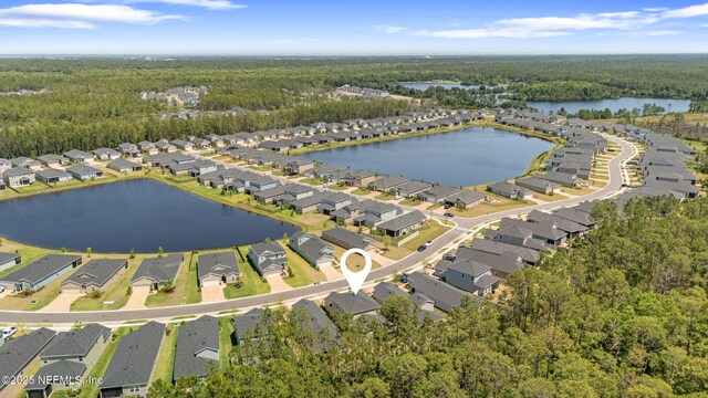 727 Lake Sinclair St, Saint Augustine, FL 32084 - aerial overview of property's location with a heavily wooded area, nearby suburban area, and a large body of water