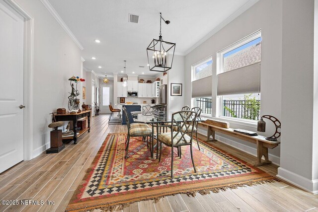 40 Martha Ct, Saint Augustine, FL 32092 - dining area featuring ornamental molding, healthy amount of natural light, baseboards, light wood-style floors, and recessed lighting