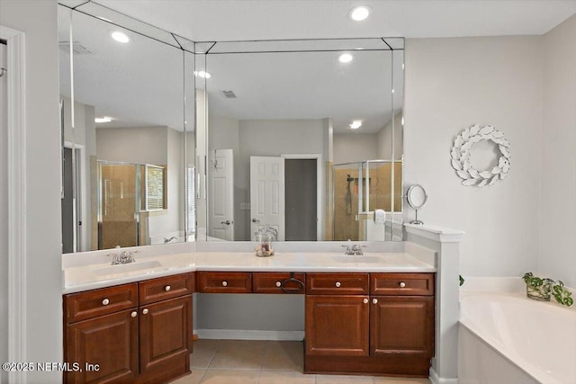 2005 Rivers Own Rd, Saint Augustine, FL 32092 - bathroom featuring a stall shower, double vanity, tile patterned flooring, a bath, and recessed lighting