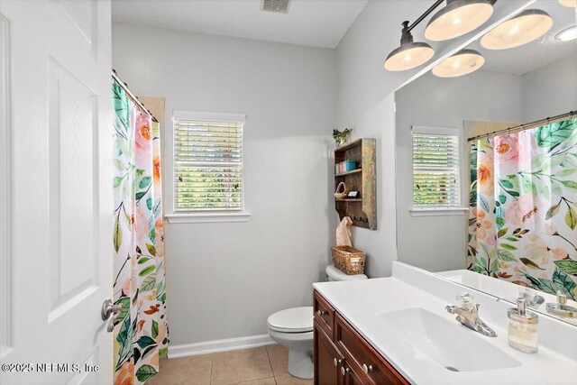2005 Rivers Own Rd, Saint Augustine, FL 32092 - full bathroom with healthy amount of natural light, vanity, tile patterned floors, and toilet