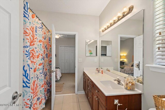 2005 Rivers Own Rd, Saint Augustine, FL 32092 - ensuite bathroom featuring double vanity, tile patterned flooring, and curtained shower