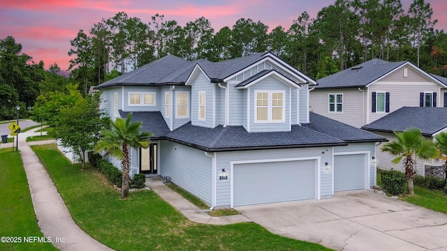 514 Heron Landing Rd, Saint Johns, FL 32259 - view of front of property featuring concrete driveway, a yard, an attached garage, and roof with shingles