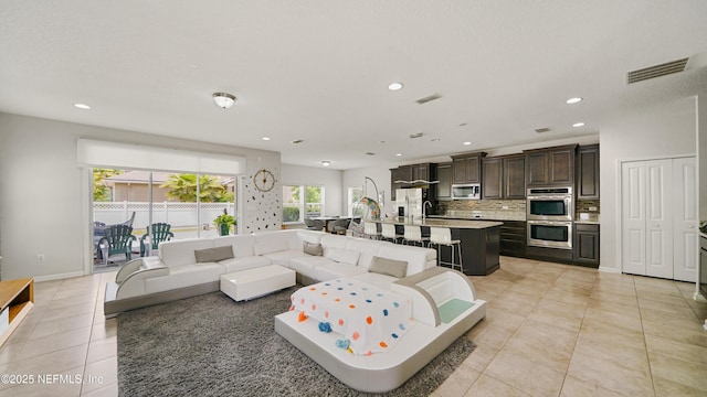 514 Heron Landing Rd, Saint Johns, FL 32259 - living area featuring light tile patterned floors and recessed lighting