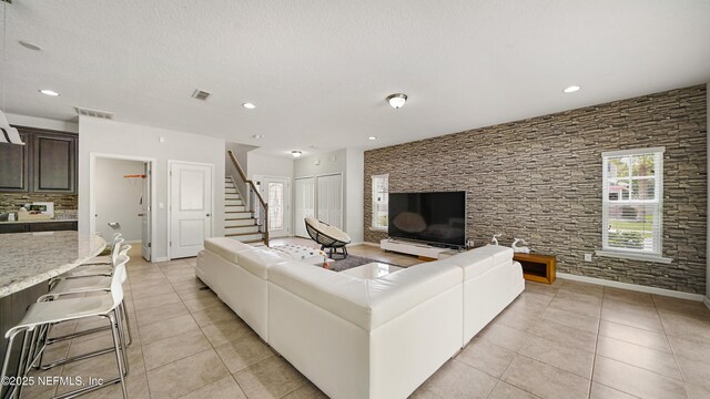 514 Heron Landing Rd, Saint Johns, FL 32259 - living area featuring light tile patterned flooring, stairs, recessed lighting, and baseboards