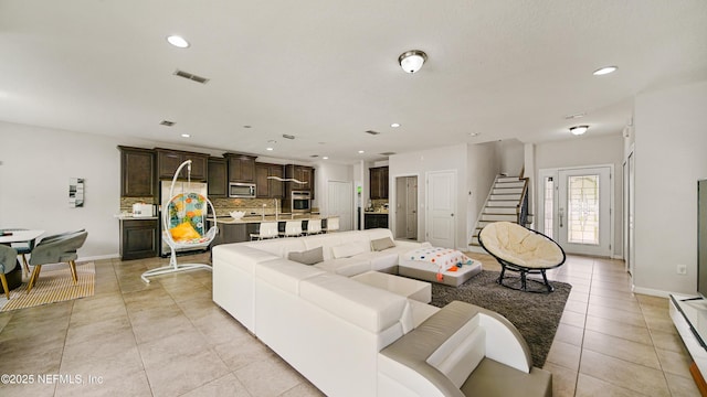 514 Heron Landing Rd, Saint Johns, FL 32259 - living room with stairs, recessed lighting, baseboard heating, light tile patterned flooring, and baseboards
