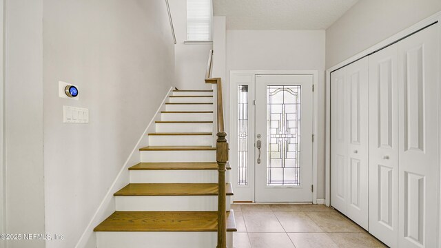 514 Heron Landing Rd, Saint Johns, FL 32259 - foyer featuring stairs and light tile patterned floors