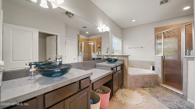 514 Heron Landing Rd, Saint Johns, FL 32259 - bathroom with a shower stall, a bath, vanity, tile patterned flooring, and recessed lighting