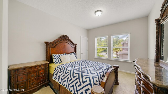 514 Heron Landing Rd, Saint Johns, FL 32259 - bedroom with light carpet, baseboards, and a textured ceiling