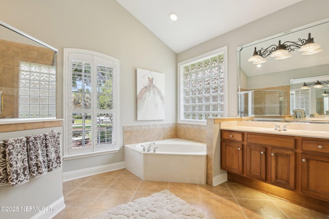 717 E Dorchester Dr, Saint Johns, FL 32259 - bathroom featuring vanity, a garden tub, tile patterned flooring, lofted ceiling, and a shower stall
