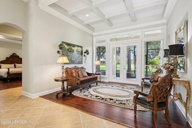 717 E Dorchester Dr, Saint Johns, FL 32259 - living area featuring tile patterned floors, arched walkways, french doors, beam ceiling, and coffered ceiling