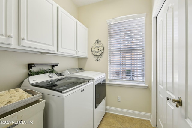 717 E Dorchester Dr, Saint Johns, FL 32259 - laundry area with washing machine and clothes dryer, baseboards, cabinet space, and light tile patterned floors