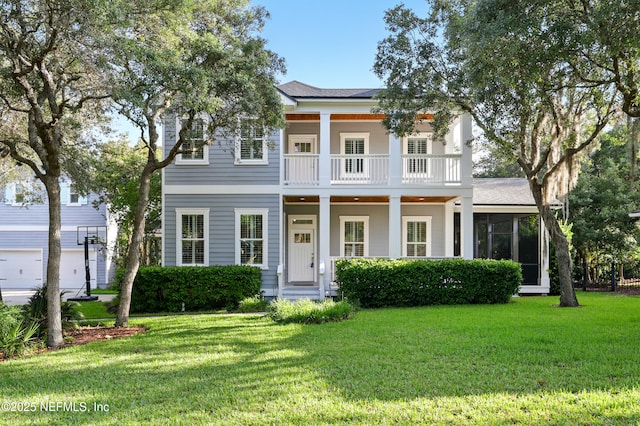 318 Sophia Ter, Saint Augustine, FL 32095 - neoclassical / greek revival house featuring a balcony, a front lawn, and a shingled roof