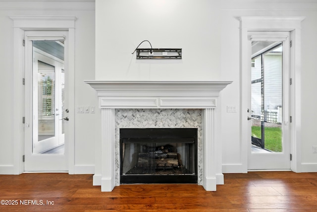 318 Sophia Ter, Saint Augustine, FL 32095 - detailed view of wood finished floors, a fireplace, and baseboards