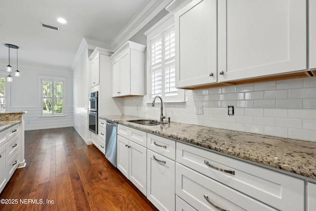 318 Sophia Ter, Saint Augustine, FL 32095 - kitchen featuring ornamental molding, a sink, stainless steel appliances, white cabinets, and plenty of natural light