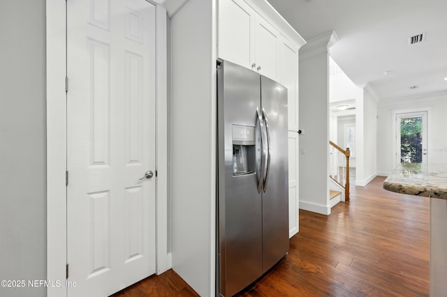 318 Sophia Ter, Saint Augustine, FL 32095 - kitchen featuring stainless steel refrigerator with ice dispenser, ornamental molding, white cabinetry, dark wood finished floors, and light stone countertops