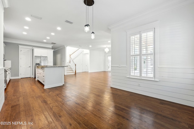 318 Sophia Ter, Saint Augustine, FL 32095 - unfurnished living room featuring ornamental molding, stairway, dark wood finished floors, and recessed lighting