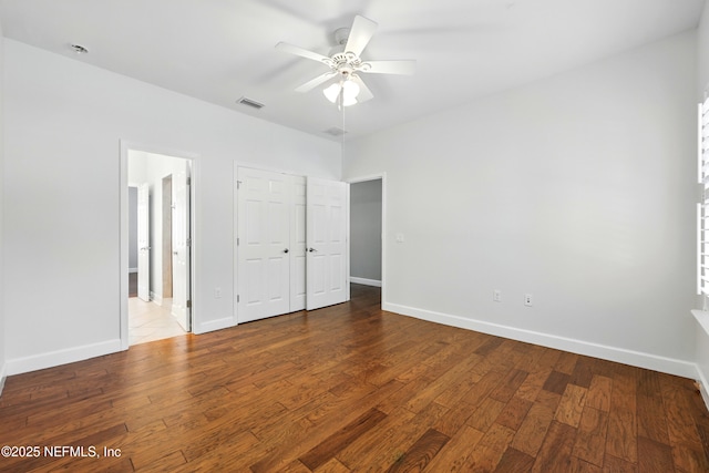 318 Sophia Ter, Saint Augustine, FL 32095 - unfurnished bedroom featuring wood finished floors, baseboards, ensuite bathroom, and a closet