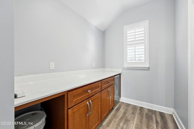318 Sophia Ter, Saint Augustine, FL 32095 - bathroom featuring wood finished floors, vaulted ceiling, and baseboards