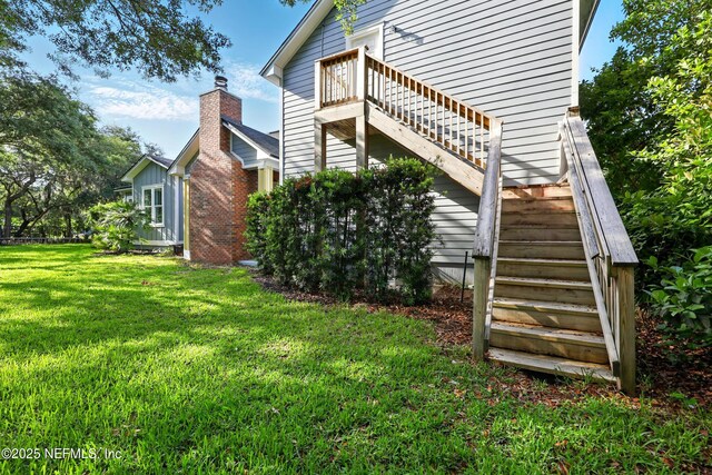 318 Sophia Ter, Saint Augustine, FL 32095 - view of side of property with stairway and a lawn