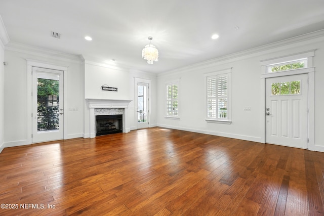 318 Sophia Ter, Saint Augustine, FL 32095 - unfurnished living room featuring ornamental molding, hardwood / wood-style flooring, a chandelier, baseboards, and a premium fireplace