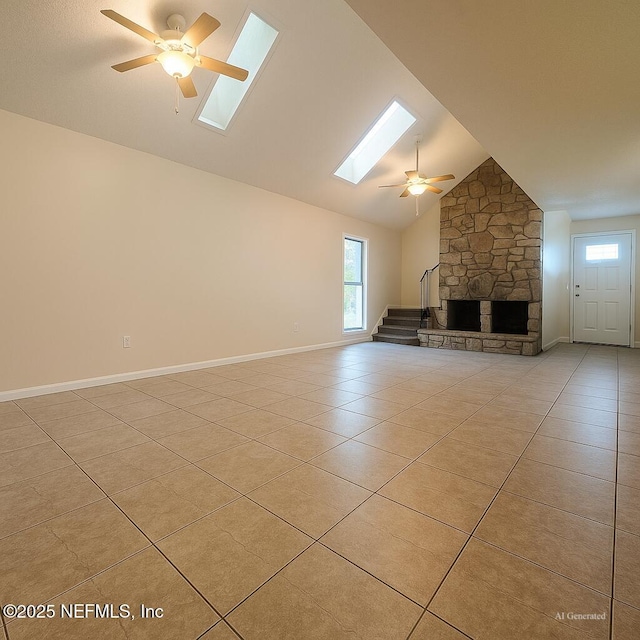10244 Pine Breeze Rd W, Jacksonville, FL 32257 - unfurnished living room featuring a skylight, light tile patterned floors, ceiling fan, plenty of natural light, and high vaulted ceiling