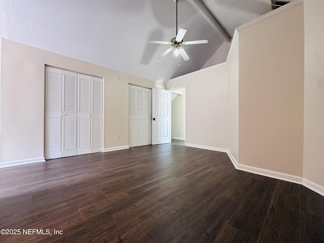 10244 Pine Breeze Rd W, Jacksonville, FL 32257 - unfurnished bedroom with two closets, dark wood-style flooring, and baseboards