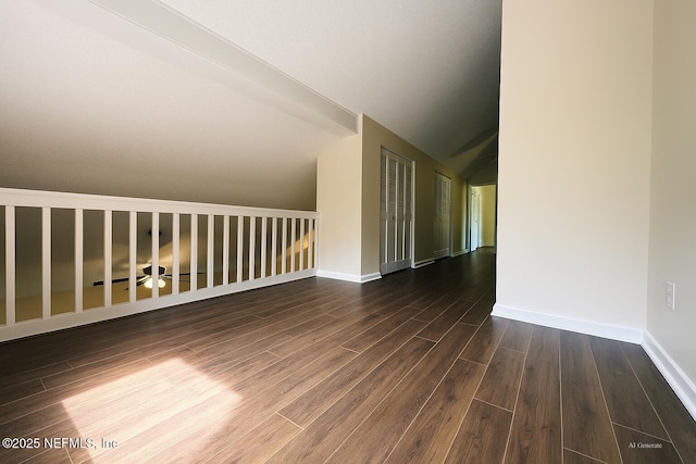 10244 Pine Breeze Rd W, Jacksonville, FL 32257 - empty room featuring wood finished floors, lofted ceiling, and baseboards