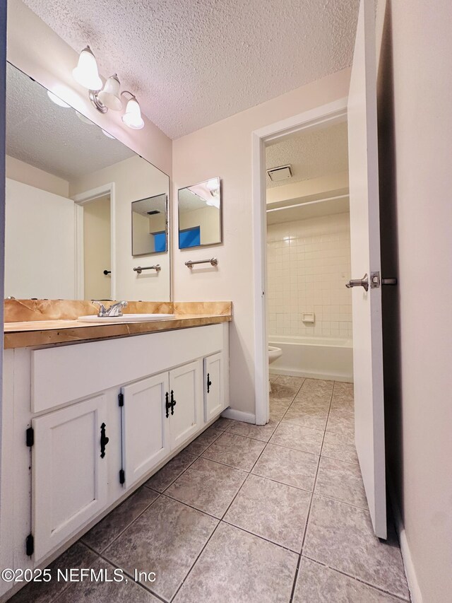 10244 Pine Breeze Rd W, Jacksonville, FL 32257 - full bath featuring vanity, a textured ceiling, toilet, tile patterned flooring, and baseboards