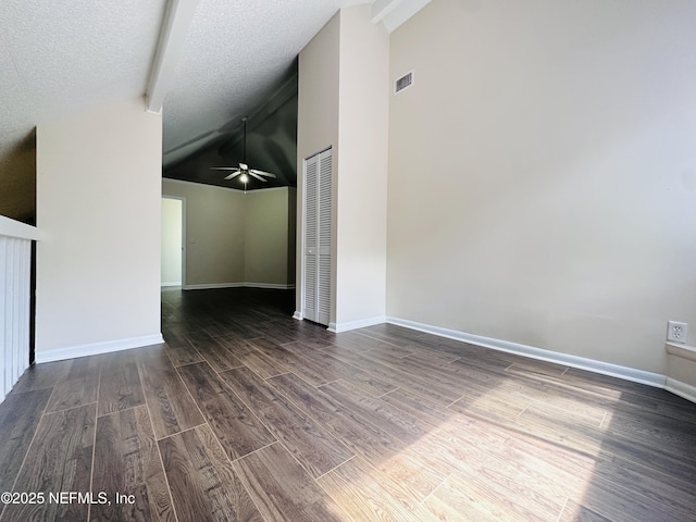 10244 Pine Breeze Rd W, Jacksonville, FL 32257 - spare room featuring wood finished floors, a ceiling fan, baseboards, high vaulted ceiling, and a textured ceiling