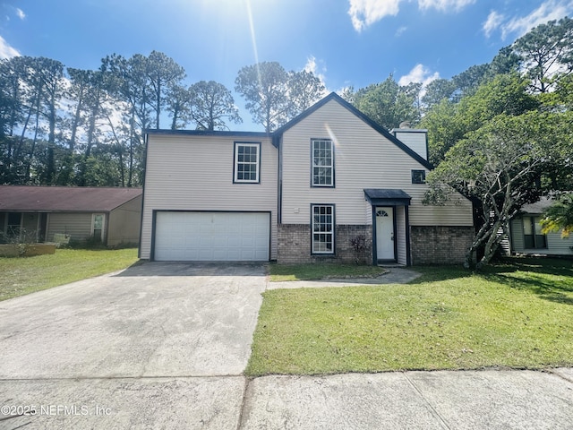 10244 Pine Breeze Rd W, Jacksonville, FL 32257 - view of front of home featuring driveway, a garage, a front lawn, and brick siding
