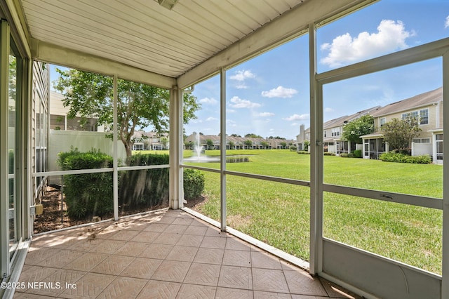 11000 Castlemain Cir E, Jacksonville, FL 32256 - unfurnished sunroom featuring a residential view and a water view
