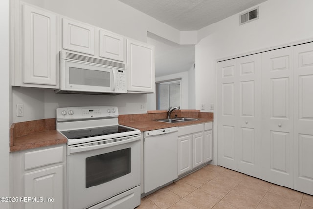 204 Augusta Cir, Saint Augustine, FL 32086 - kitchen featuring white appliances, a sink, white cabinetry, and a textured ceiling