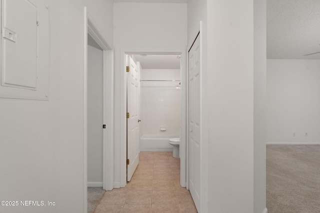 204 Augusta Cir, Saint Augustine, FL 32086 - corridor featuring light tile patterned floors, electric panel, and baseboards
