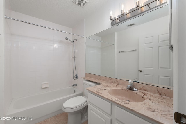 204 Augusta Cir, Saint Augustine, FL 32086 - full bathroom with vanity, toilet, shower / tub combination, tile patterned floors, and a textured ceiling