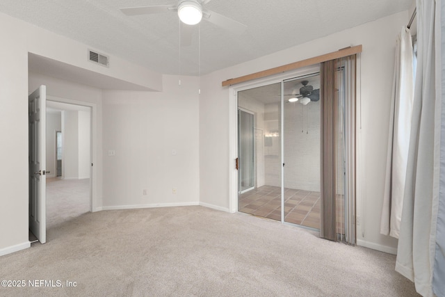 204 Augusta Cir, Saint Augustine, FL 32086 - unfurnished bedroom featuring carpet, ceiling fan, baseboards, and a textured ceiling