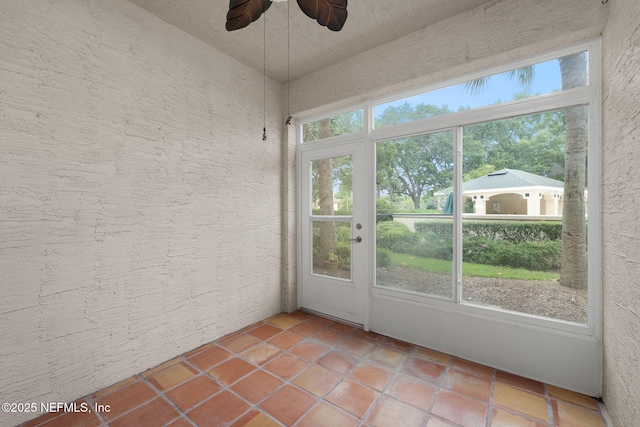 204 Augusta Cir, Saint Augustine, FL 32086 - unfurnished sunroom with ceiling fan and tile patterned floors