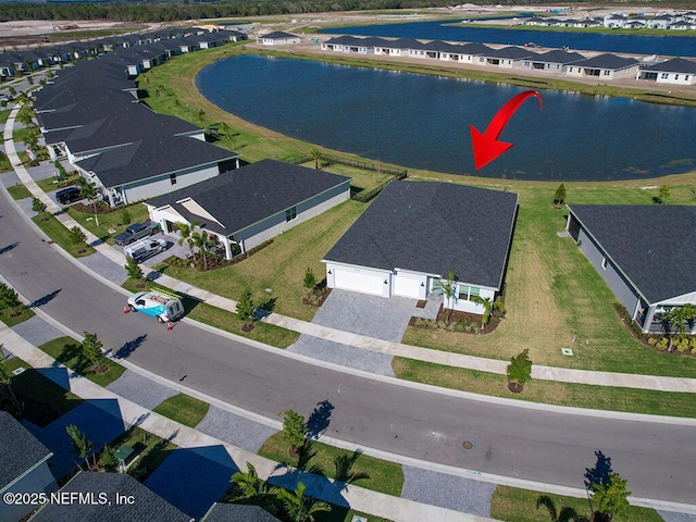 aerial perspective of suburban area with a large body of water