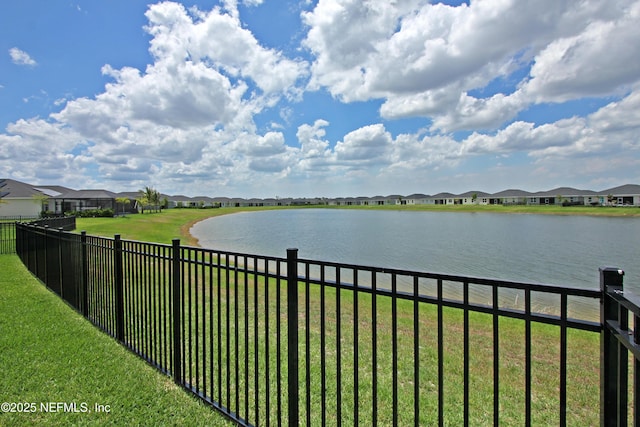 water view featuring nearby suburban area and fence